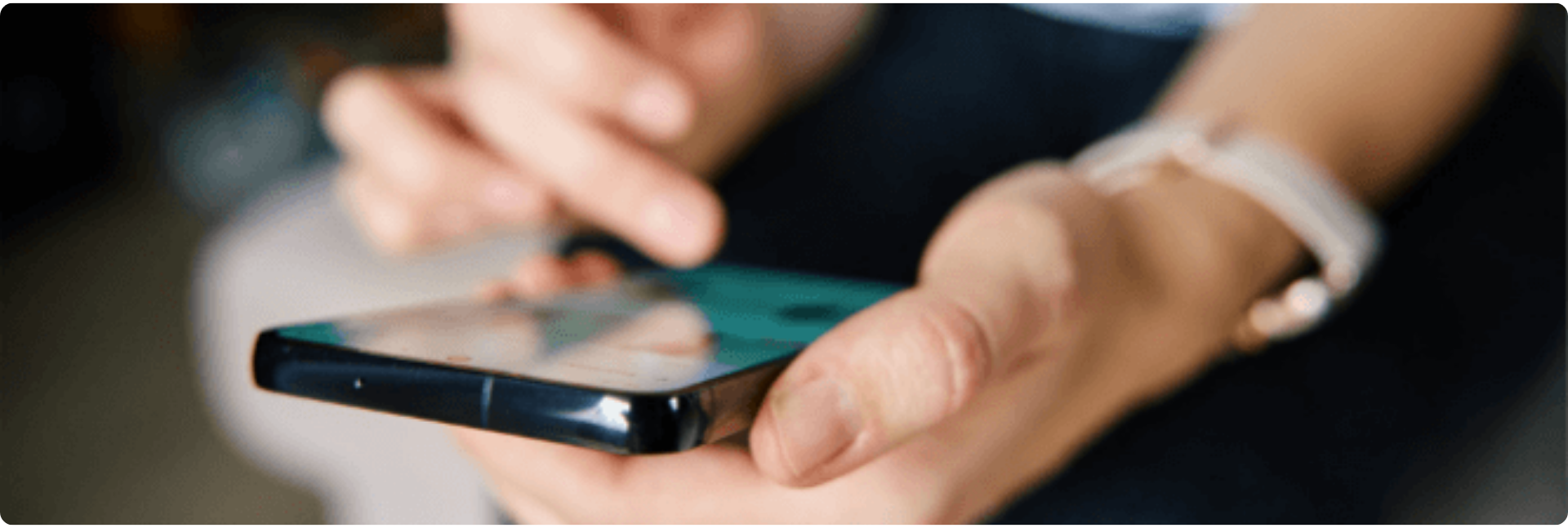 Close-up of a person using a smartphone, tapping the screen with one hand while holding it with the other, symbolizing digital engagement and connectivity. Ideal for promoting social media resilience training for local government.